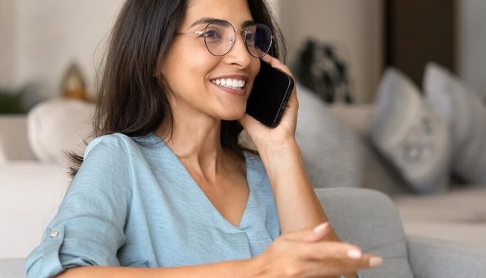 Woman calling a behavioral health admissions team to begin the treatment process