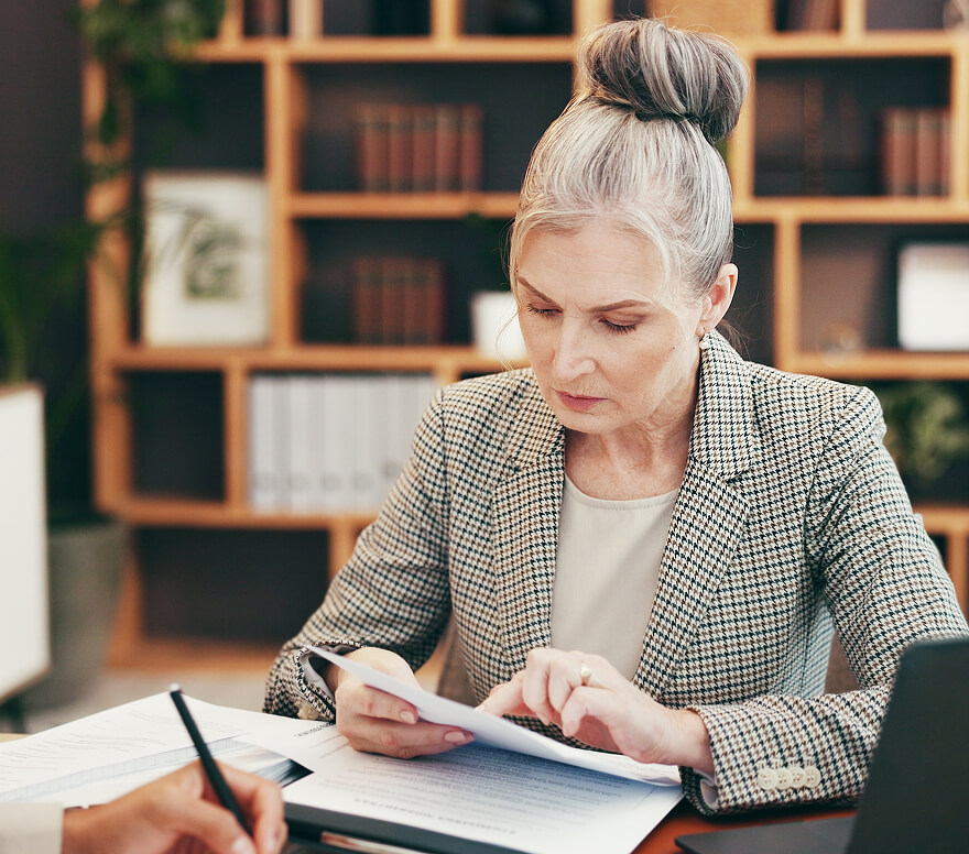 Case manager reviewing personalized detox plan and intake assessment with client at desk