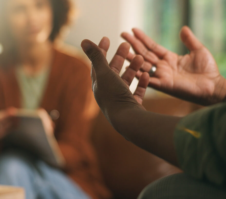 walk-in-clinic Close-up of hands gesturing during a conversation with a therapist.